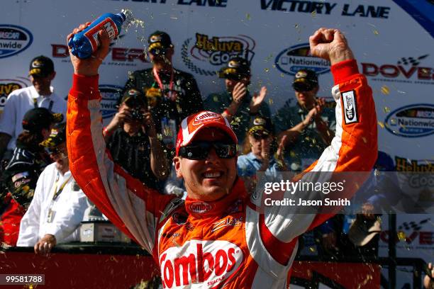Kyle Busch, driver of the Combos Toyota, celebrates in Victory Lane after winning the NASCAR Nationwide Series Heluva Good! 200 at Dover...
