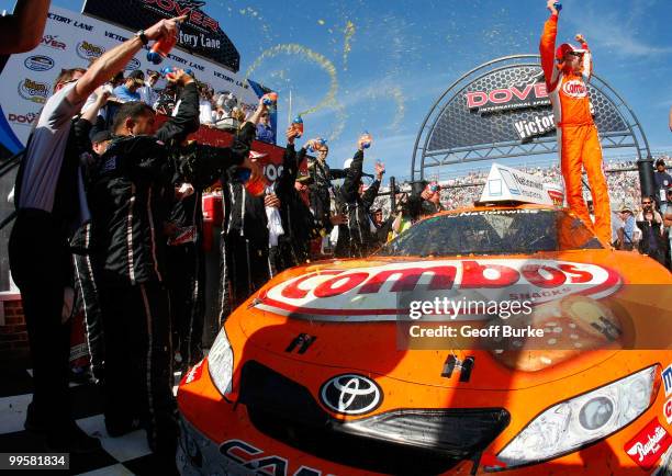Kyle Busch, driver of the Combos Toyota, celebrates in Victory Lane after winning the NASCAR Nationwide Series Heluva Good! 200 at Dover...