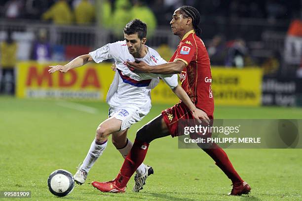 Lyon's Bosnian midfielder Miralem Pjanic vies with Le Mans' French midfielder Frederic Thomas during the French L1 football match Lyon vs Le Mans on...