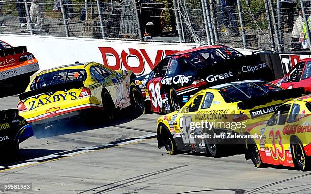 Clint Bowyer, driver of the Zaxby's Chevrolet, collides with Kasey Kahne, driver of the Great Clips Toyota, during the NASCAR Nationwide Series...