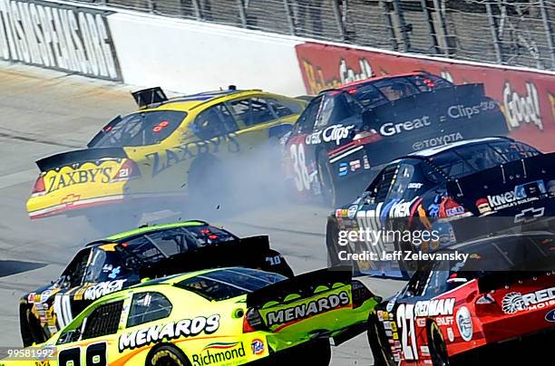 Clint Bowyer, driver of the Zaxby's Chevrolet, collides with Kasey Kahne, driver of the Great Clips Toyota, during the NASCAR Nationwide Series...