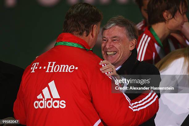 Head coach Louis van Gaal of Bayern Muenchen is congratulated by German president Horst Koehler following his team's victory at the end of the DFB...