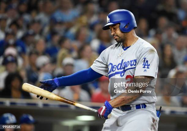 Matt Kemp of the Los Angeles Dodgers reacts after striking out during the seventh inning of a baseball game against the San Diego Padres at PETCO...