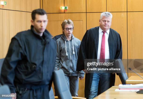 Defendant Marcel H. Is accompanied into the courtroom by his lawyer Michael Emde at the regional court in Bochum, Germany, 4 October 2017. The...