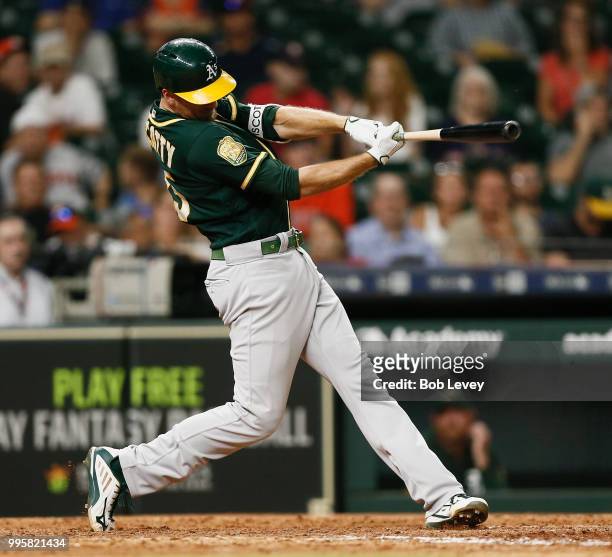 Stephen Piscotty of the Oakland Athletics hits a home run in the eleventh inning against the Houston Astros at Minute Maid Park on July 10, 2018 in...