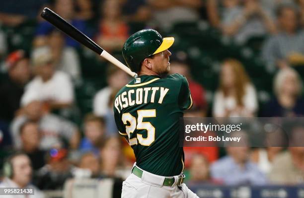 Stephen Piscotty of the Oakland Athletics hits a home run in the eleventh inning against the Houston Astros at Minute Maid Park on July 10, 2018 in...