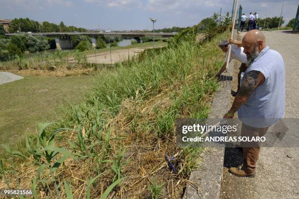 Inmates of the Rebibbia prison, work using garden tools, sharp implements, shears and trimmers, as part of a gardening project called " the beach on...