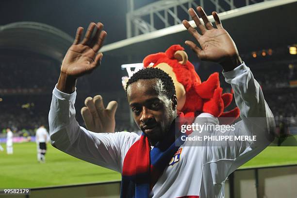 Lyon's French forward Sidney Govou celebrates at the end of the French L1 football match Lyon vs Le Mans, on May 15, 2010 at the Gerland stadium in...