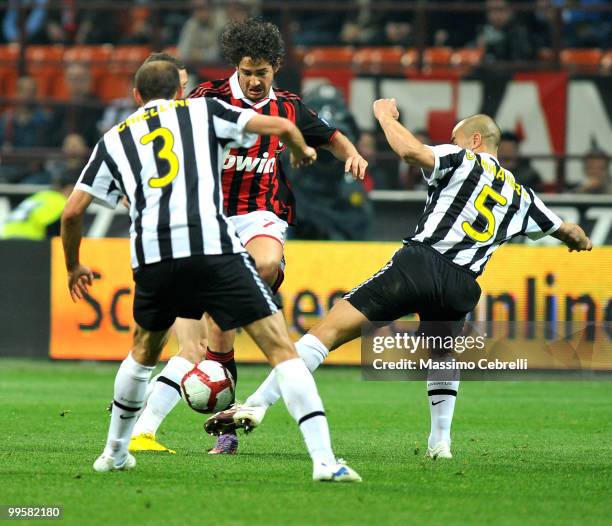 Alexandre Pato of AC Milan battles for the ball against Giorgio Chiellini and Fabio Cannavaro of Juventus FC during the Serie A match between AC...