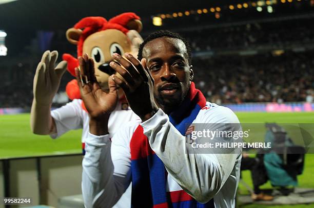 Lyon's French forward Sidney Govou celebrates at the end of the French L1 football match Lyon vs Le Mans on May 15, 2010 at the Gerland stadium in...