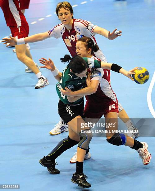Varzaru Cristina of Viborg competes for the ball with Ardean Elisei Valentina of Oltchim Ramnicu Valcea during the second leg women's handball...