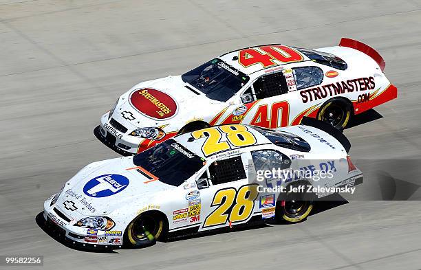 Kenny Wallace, driver of the Jay Robinson Racing Chevrolet, and Mike Bliss, driver of the Key Motorsports Chevrolet, races side by side during the...