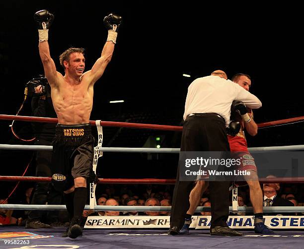 Michael Katsidis of Australia celebrates beating Kevin Mitchell of England in the third round to retain the WBO Lightweight Championship of the World...