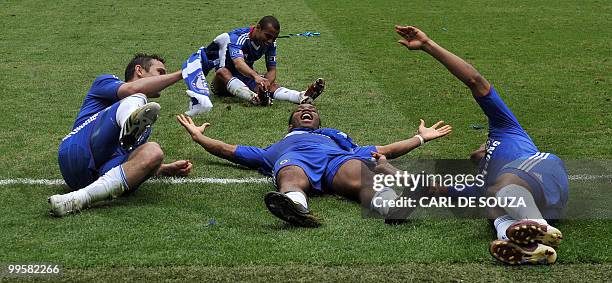 Chelsea's Didier Drogba celebrates with team-mates after they beat Portsmouth 1-0 during the FA Cup Final football match at Wembley, in north London,...