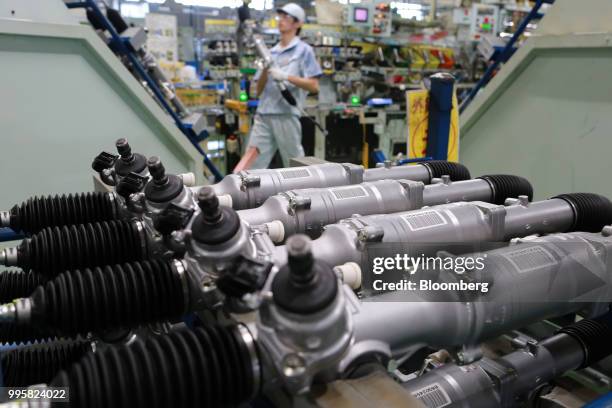 Electric power steering gears sit on the production line at the Jtekt Corp. Hanazono plant in Okazaki, Aichi Prefecture, Japan, on Tuesday, July 10,...