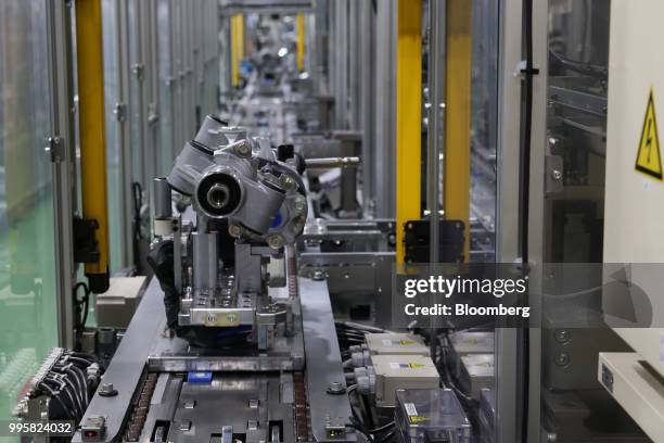 Electric power steering gears sit on the production line at the Jtekt Corp. Hanazono plant in Okazaki, Aichi Prefecture, Japan, on Tuesday, July 10,...