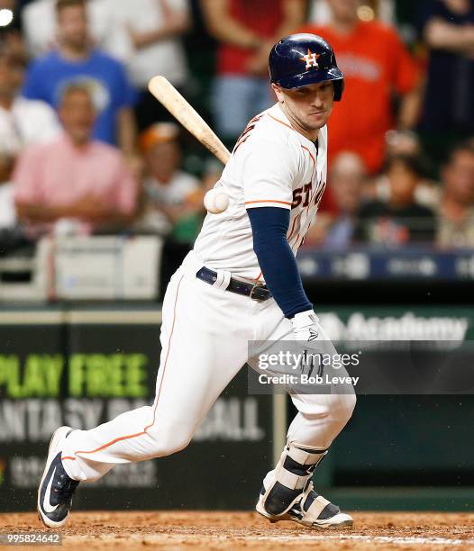 Alex Bregman of the Houston Astros hits ground ball to the catcher in the eleventh inning allowing Kyle Tucker on a throwing error by Jonathan Lucroy...