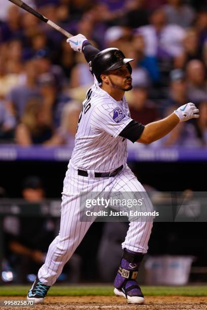 Nolan Arenado of the Colorado Rockies hits a solo home run during the seventh inning against the Arizona Diamondbacks at Coors Field on July 10, 2018...