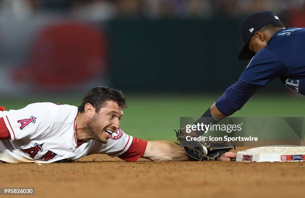 Los Angeles Angels of Anaheim second baseman Ian Kinsler is tagged out trying to steel second after sliding past the bag by Seattle Mariners...