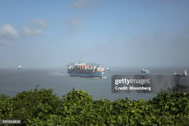 The Soro Maesk container ship, operated by A.P. Moller-Maersk A/S, sails towards Yangshan Deep Water Port in Shanghai, China, on Tuesday, July 10,...