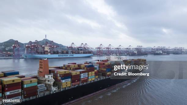 The Soro Enshi container ship, operated by A.P. Moller-Maersk A/S, sails from Yangshan Deep Water Port in this aerial photograph taken in Shanghai,...