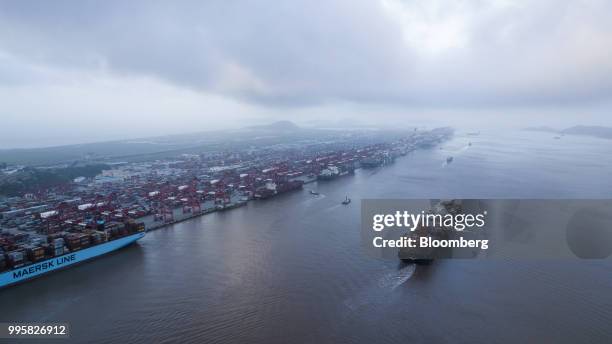 The Soro Enshi container ship, operated by A.P. Moller-Maersk A/S, sails from Yangshan Deep Water Port in this aerial photograph taken in Shanghai,...