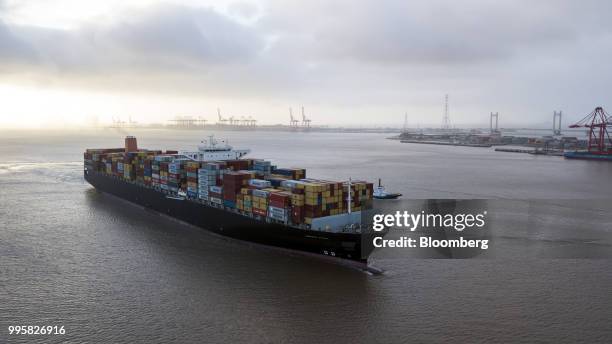 The Soro Enshi container ship, operated by A.P. Moller-Maersk A/S, sails from Yangshan Deep Water Port in this aerial photograph taken in Shanghai,...