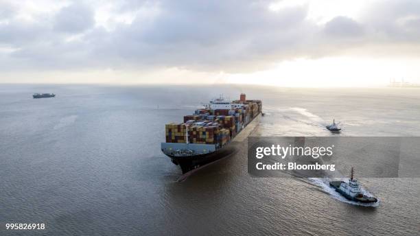 The Soro Enshi container ship, operated by A.P. Moller-Maersk A/S, sails from Yangshan Deep Water Port in this aerial photograph taken in Shanghai,...