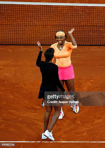 Serena Williams of the USA celebrates match point with her sister Venus Williams in their final doubles match against Gisela Dulko of Argentina and...