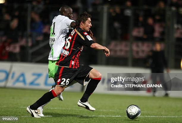 Nice's Anthony Mounier vies with St Etienne's Mouhamadou Dabo during the French L1 football match Nice vs St Etienne on May 15, 2010 at the Ray...