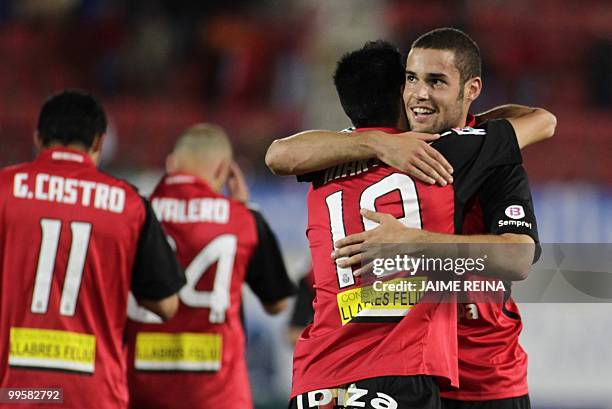 Mallorca's midfielder Mario Suarez celebrates with teammates after scoring against Espanyol during their Spanish League football match at the Ono...