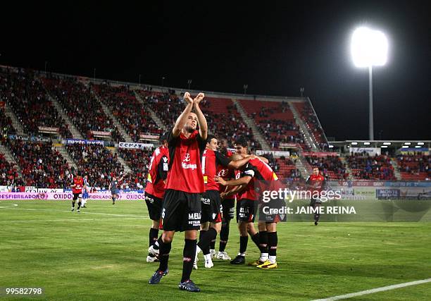 Mallorca's players celebrate after scoring against Espanyol during their Spanish League football match at the Ono Stadium in Palma de Mallorca, on...