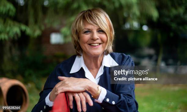 June 2018, Germany, Buechten: The presenter Alida Gundlach sits on a bench in her garden. Gundlach celebrates her 75th birthday on 17 July. Photo:...
