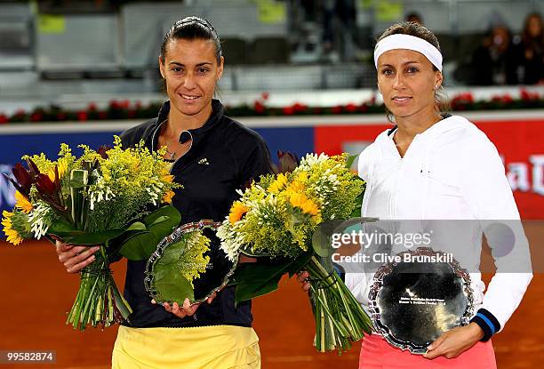 Gisela Dulko of Argentina and Flavia Pannetta of Italy hold their runners up trophies after a straight sets defeat by Venus Williams and Serena...