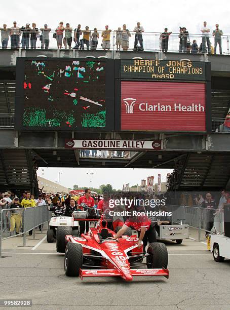 Fans watch on as team Target Chip Ganassi roll out Scott Dixon's car for the first time during opening day at the Indianapolis Motor Speedway on May...