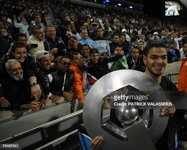 Marseille's player Hatem Ben Arfa holds the L1 French football league trophy at the end of the French L1 football match Marseille vs. Grenoble on May...