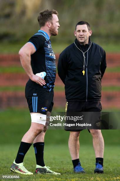 Assistant coach Jason Holland talks to Gareth Evans during a Hurricanes Super Rugby training session at Rugby League Park on July 11, 2018 in...
