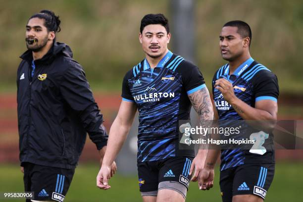 To R, Michael Fatialofa, Ben Lam and Julian Savea look on during a Hurricanes Super Rugby training session at Rugby League Park on July 11, 2018 in...
