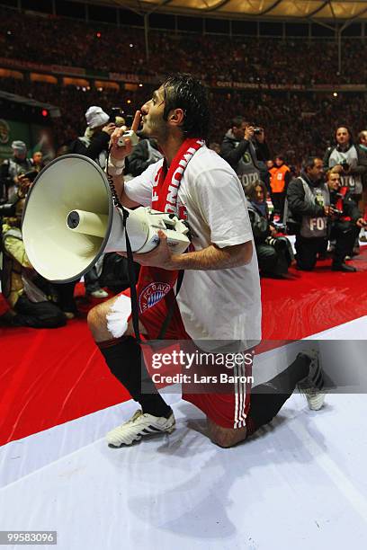 Hamit Altintop of Bayern Muenchen celebrates with a megaphone following his team's victory at the end of the DFB Cup final match between SV Werder...