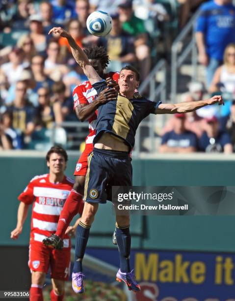 Sebastien Le Toux of the Philadelphia Union heads the ball in front of Ugo Ihemelu of FC Dallas on May 15, 2010 at Lincoln Financial Field in...