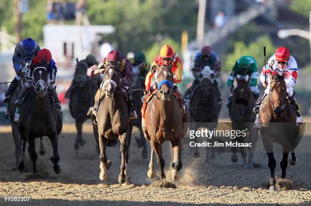 Lookin At Lucky, ridden by Martin Garcia, holds off First Dude, ridden by Ramon Dominguez, and Jackson Bend , ridden by Mike Smith, down the...