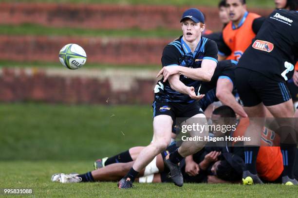 Finlay Christie passes during a Hurricanes Super Rugby training session at Rugby League Park on July 11, 2018 in Wellington, New Zealand.