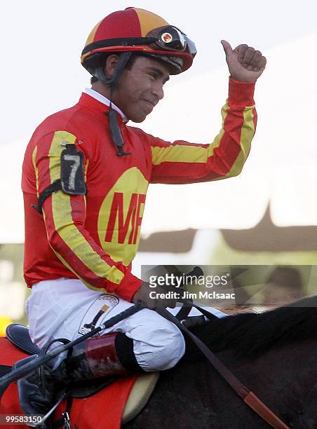 Martin Garcia celebrates after riding Lookin At Lucky to victory in the 135th running of the Preakness Stakes at Pimlico Race Course on May 15, 2010...