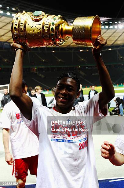 David Alaba presents the trophy after winning the DFB Cup final match between SV Werder Bremen and FC Bayern Muenchen at Olympic Stadium on May 15,...