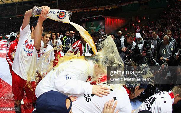 Player of Bayern celebrate with beer shower after winning the DFB Cup final match between SV Werder Bremen and FC Bayern Muenchen at Olympic Stadium...