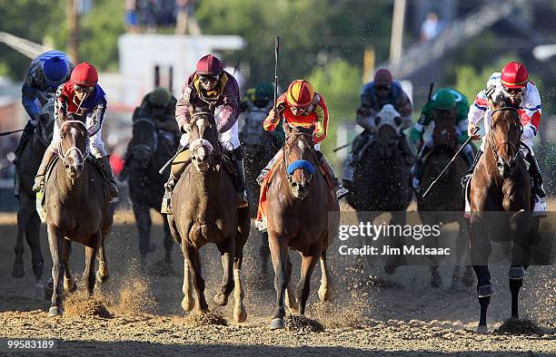 Lookin At Lucky , ridden by Martin Garcia, holds off First Dude, ridden by Ramon Dominguez, and Jackson Bend , ridden by Mike Smith, down the...