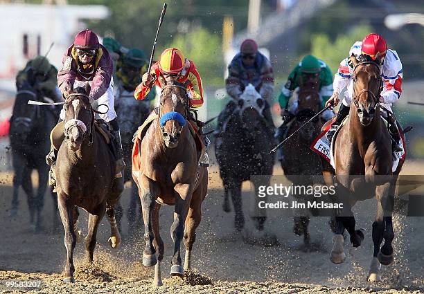 Lookin At Lucky , ridden by Martin Garcia, holds off First Dude, ridden by Ramon Dominguez, and Jackson Bend , ridden by Mike Smith, down the...