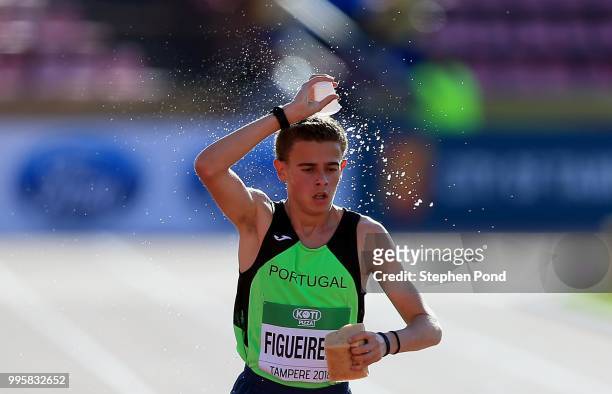 Alexandre Figueiredo of Portugal takes a drink in the Men's 10000m Final on day one of The IAAF World U20 Championships on July 10, 2018 in Tampere,...