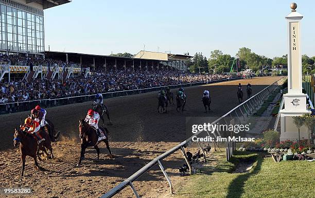 Lookin At Lucky, ridden by Martin Garcia, holds off First Dude, ridden by Ramon Dominguez, and Jackson Bend , ridden by Mike Smith, down the...