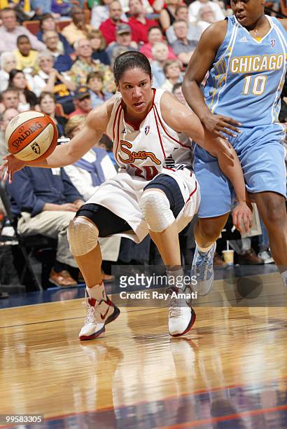Kara Lawson of the Connecticut Sun drives against Epiphanny Prince of the Chicago Sky on May 15, 2010 at Mohegan Sun Arena in Uncasville,...